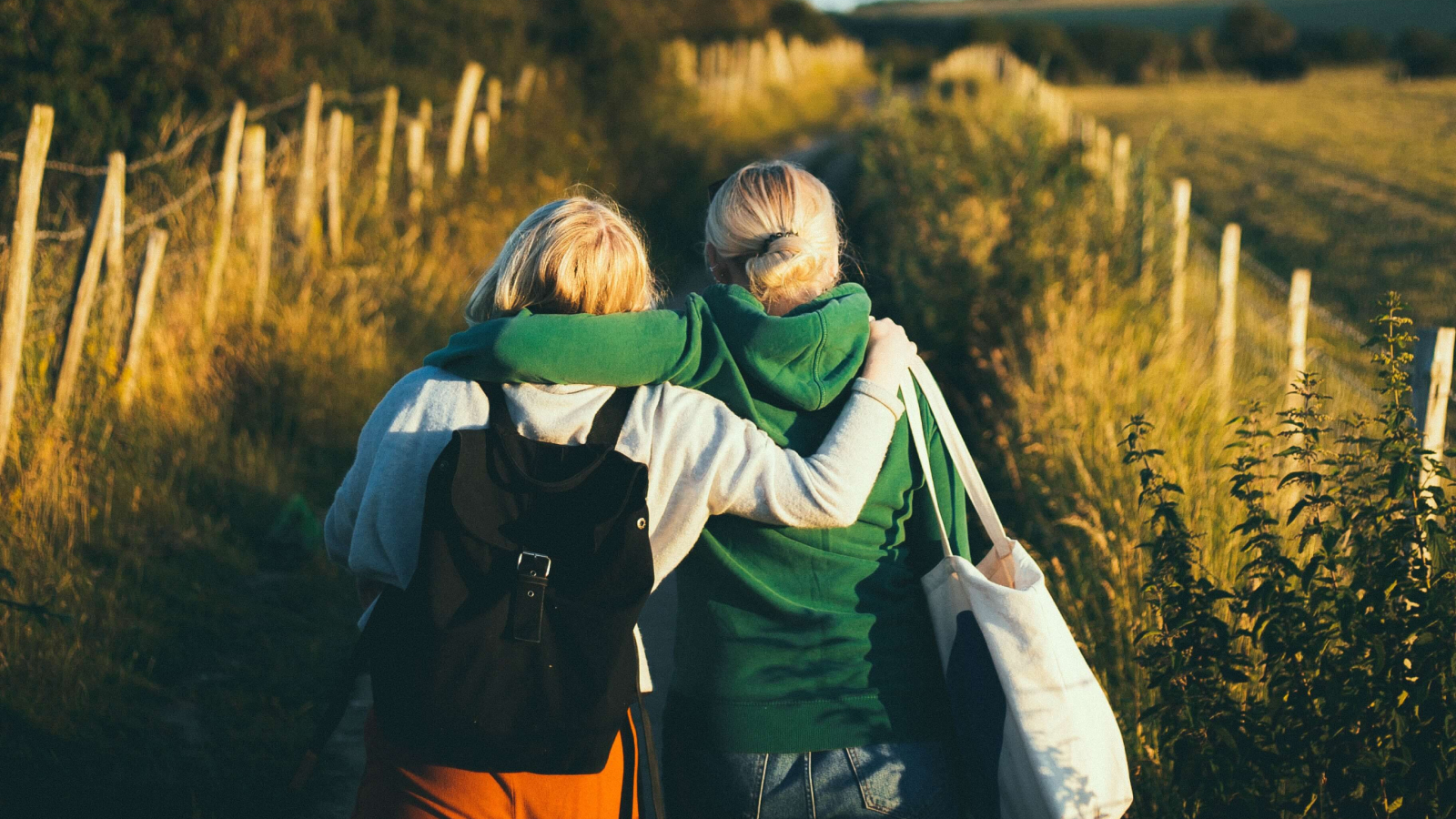 Two women walking along a trail discussing depression treatment options.