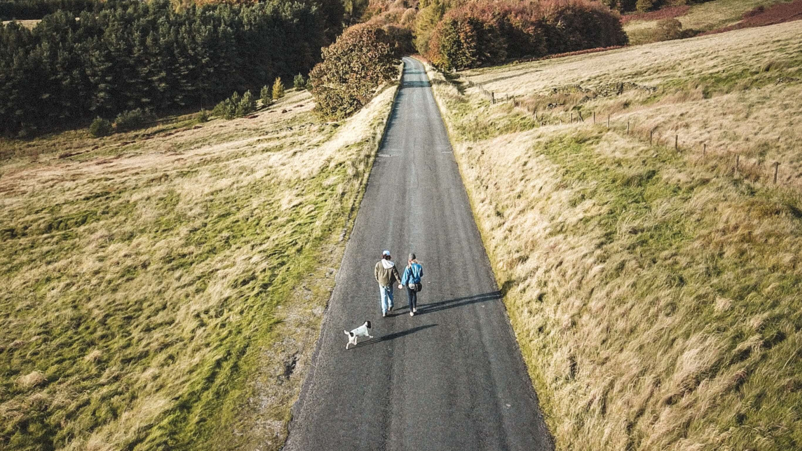 Two people walking on a road talking about trauma-informed care in Seattle.