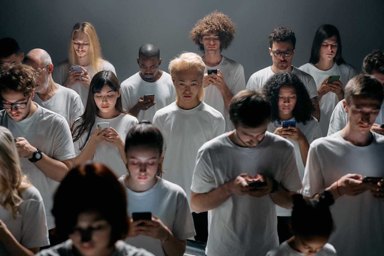 Group of People in White Shirts Addicted to phones looking for Recovery