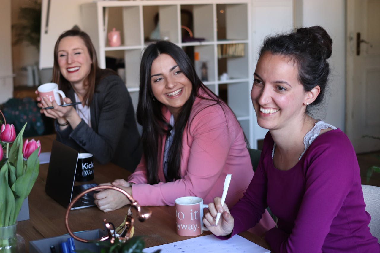 Three woman smiling after learning about adhd in woman