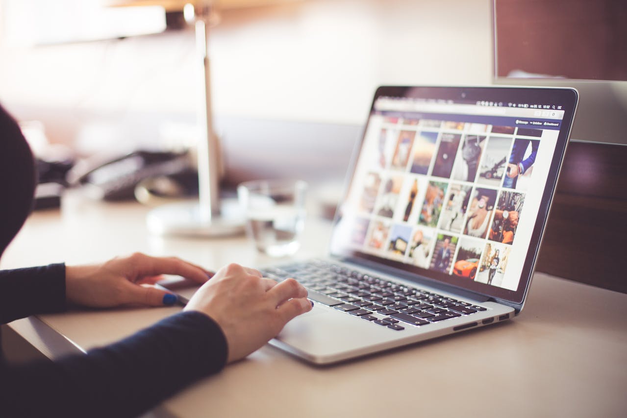 Person Using Social Media on a Laptop Computer during Daytime