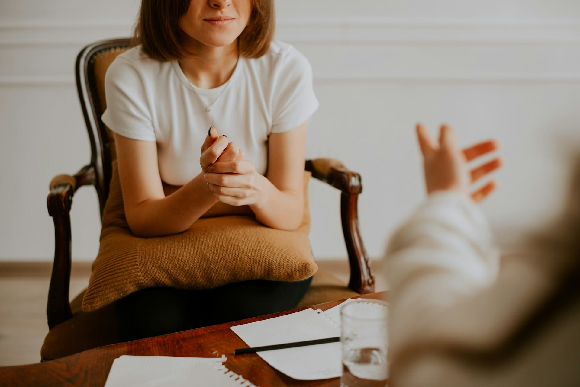 A woman at the therapist's office, working through existential grief with existential therapy.